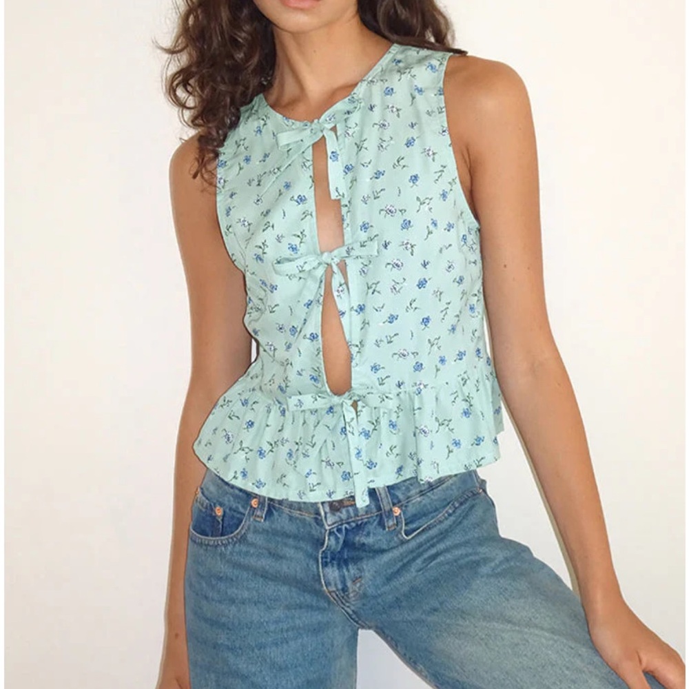 Blue Sleeveless Blouse with Tie Front and Peplum Style